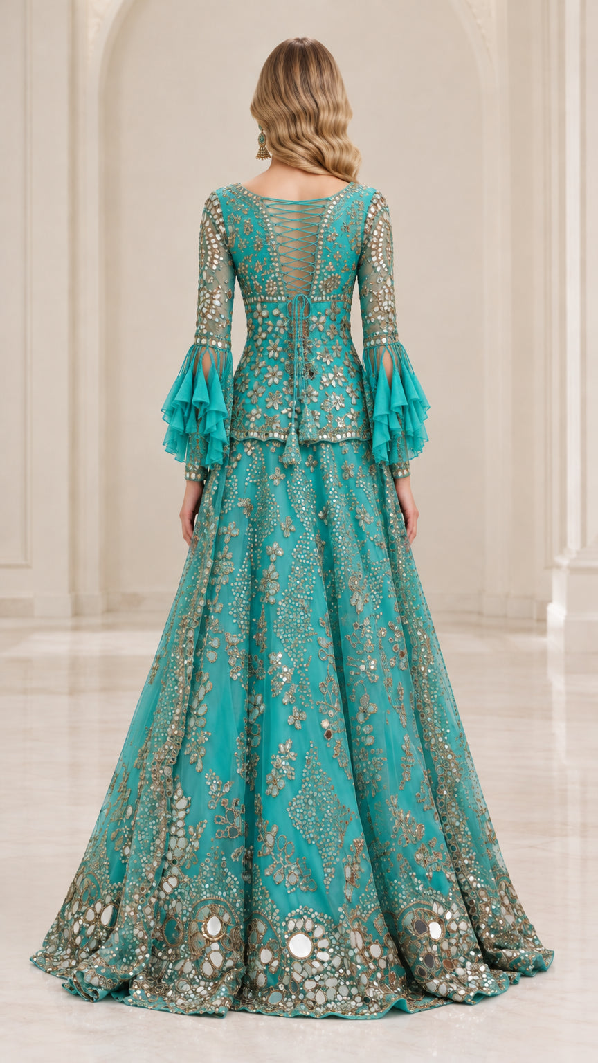 Back view of model showing strappy back detail and flared skirt in Teal