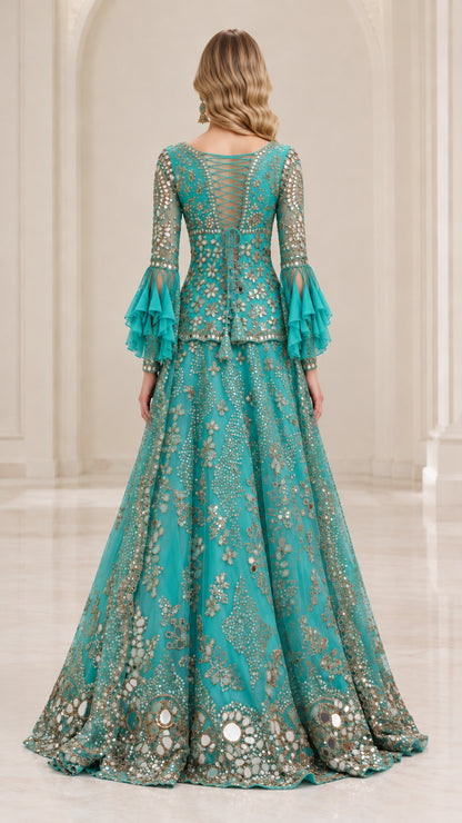 Back view of model showing strappy back detail and flared skirt in Teal