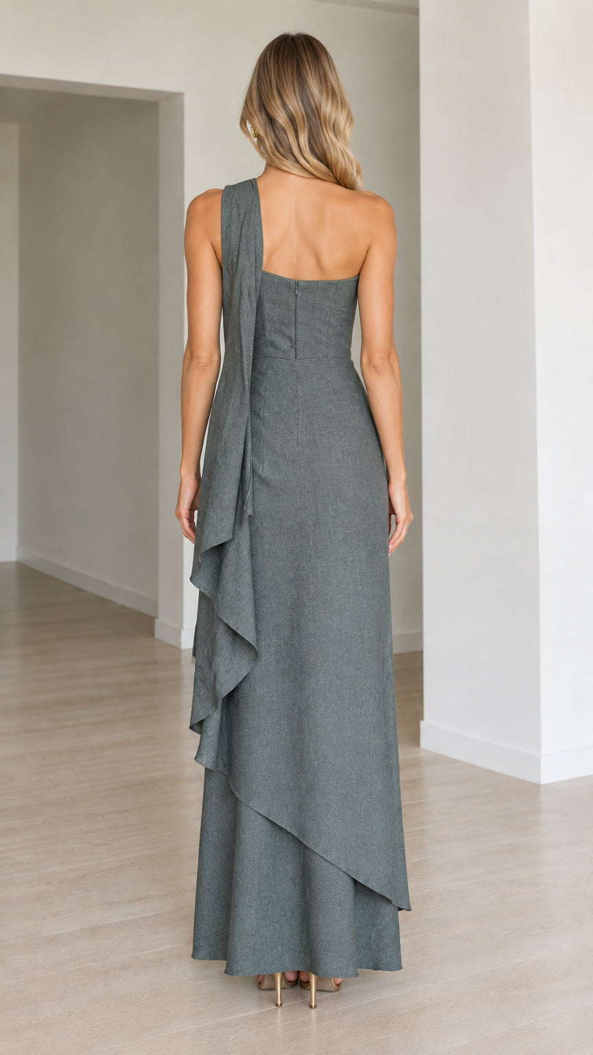 Back view of the Slate Grey one-shoulder dress showcasing the clean backline and flowing drape