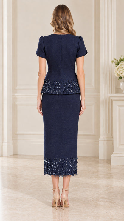 Back full-length view of navy blue tailored two-piece skirt suit set