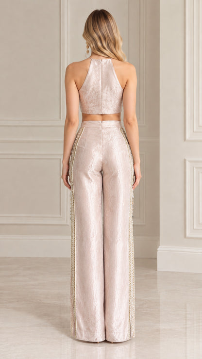 Back view of blush pink halter crop top and high-waisted wide-leg pants
