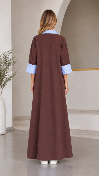 Back view of women's floor-length brown duster coat with striped cuffed sleeves