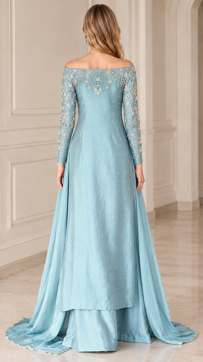Back view of dusty blue embroidered long sleeve gown set with sweeping skirt