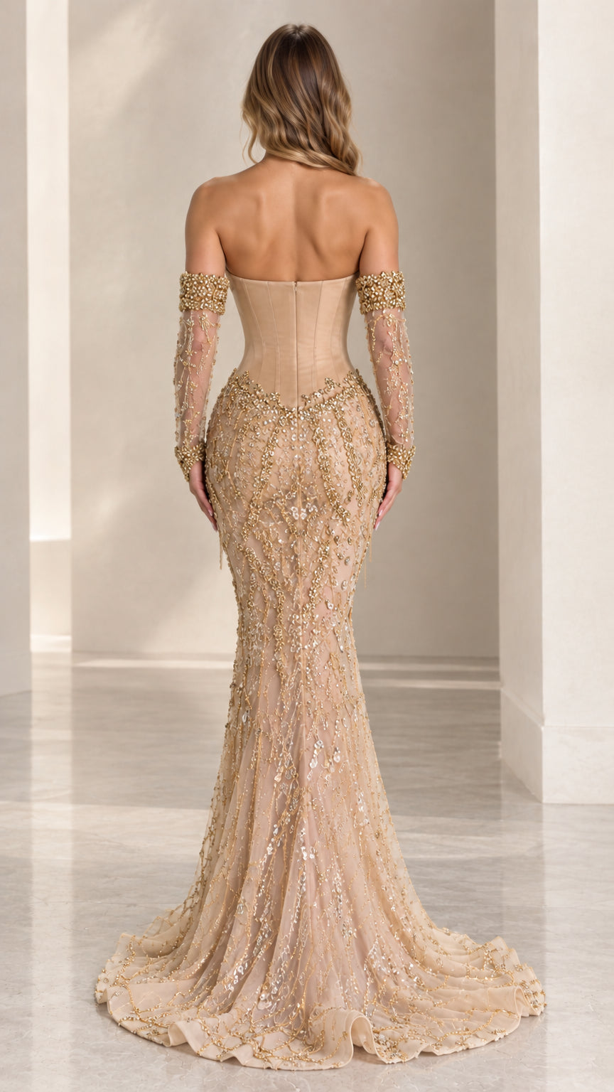 Back view of champagne strapless corset evening gown with slight train