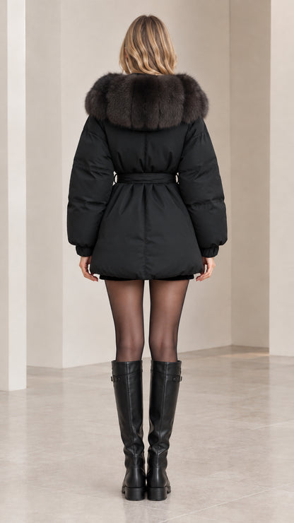 Back view of black hooded quilted puffer coat