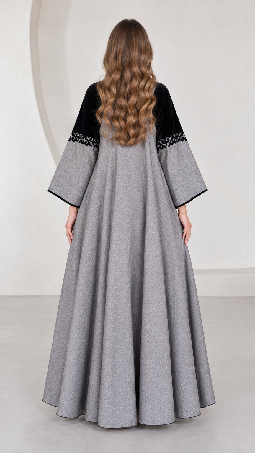 Back full-length view of grey contrast yoke maxi dress showing expansive drape