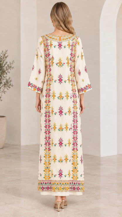 Back view of model wearing ivory embroidered kaftan dress