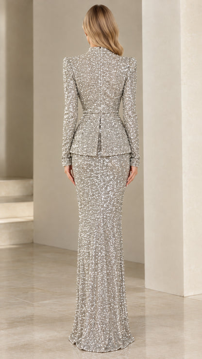 Back full-length view of silver long sleeve sequin maxi gown showing streamlined fit