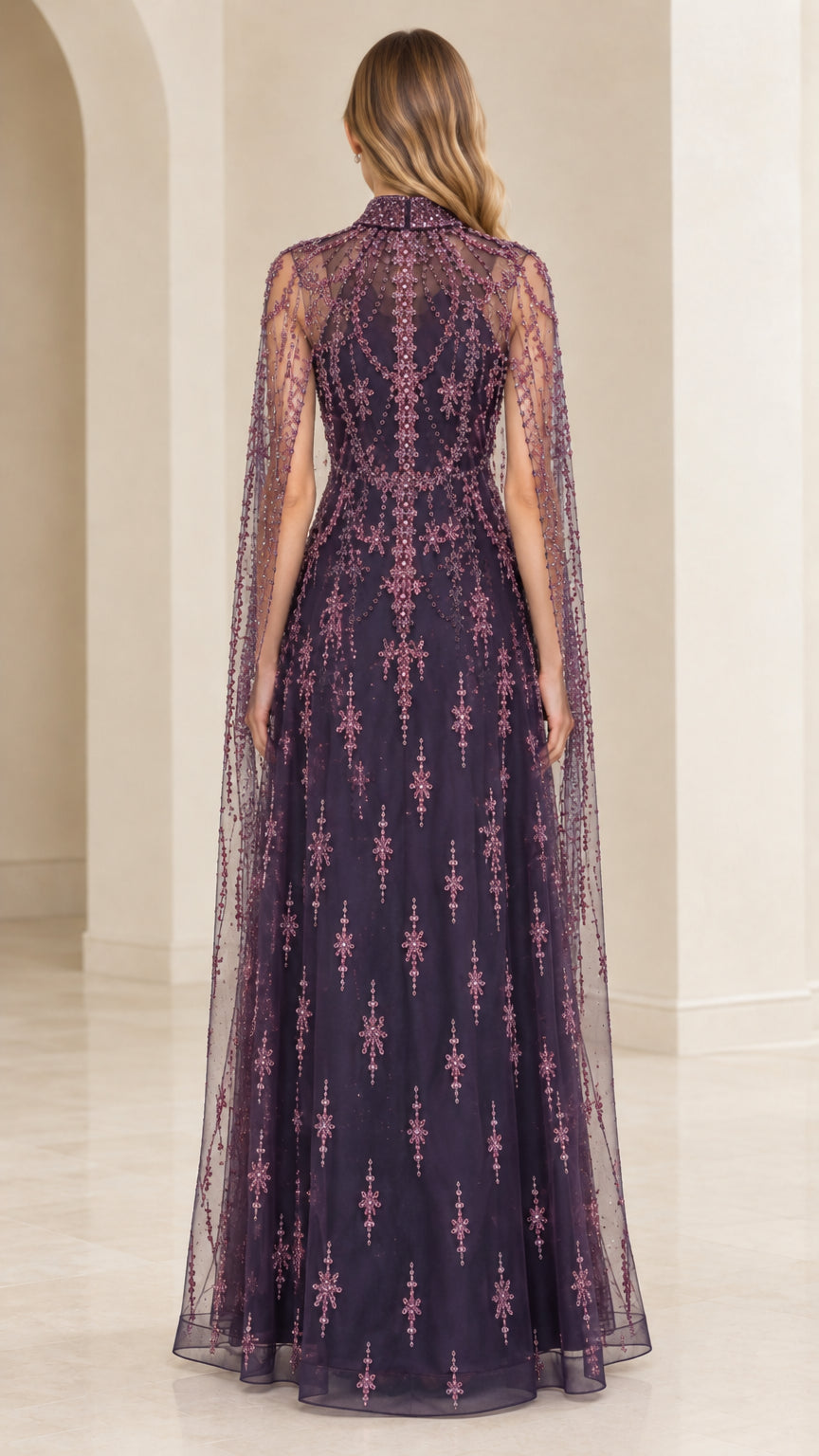 Back view of Deep Plum formal evening gown highlighting full cape drape and bead details