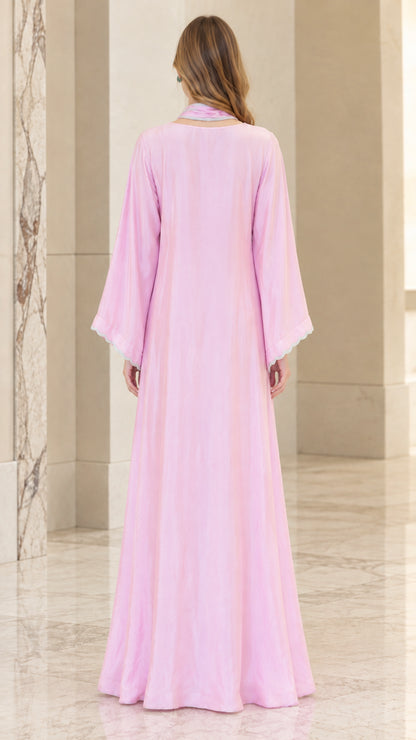 Back full view of woman wearing Light Pink floor length kaftan dress