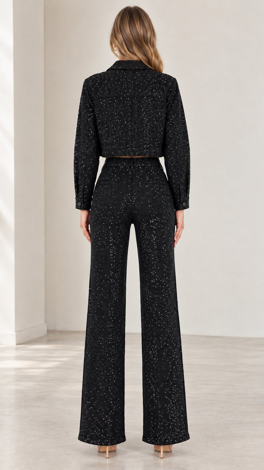 Back full-length view of black sparkle cropped jacket and wide-leg trousers