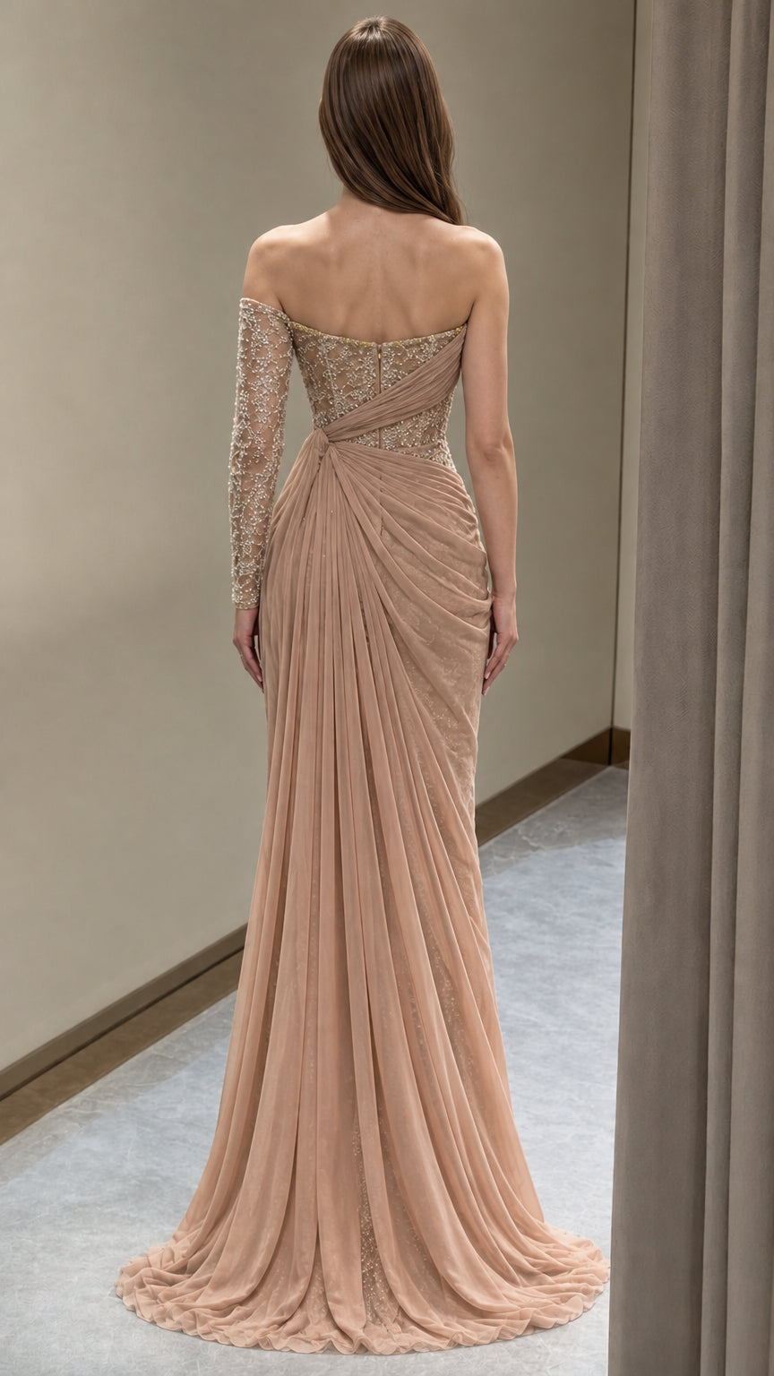 Back view of floor-length champagne draped evening gown