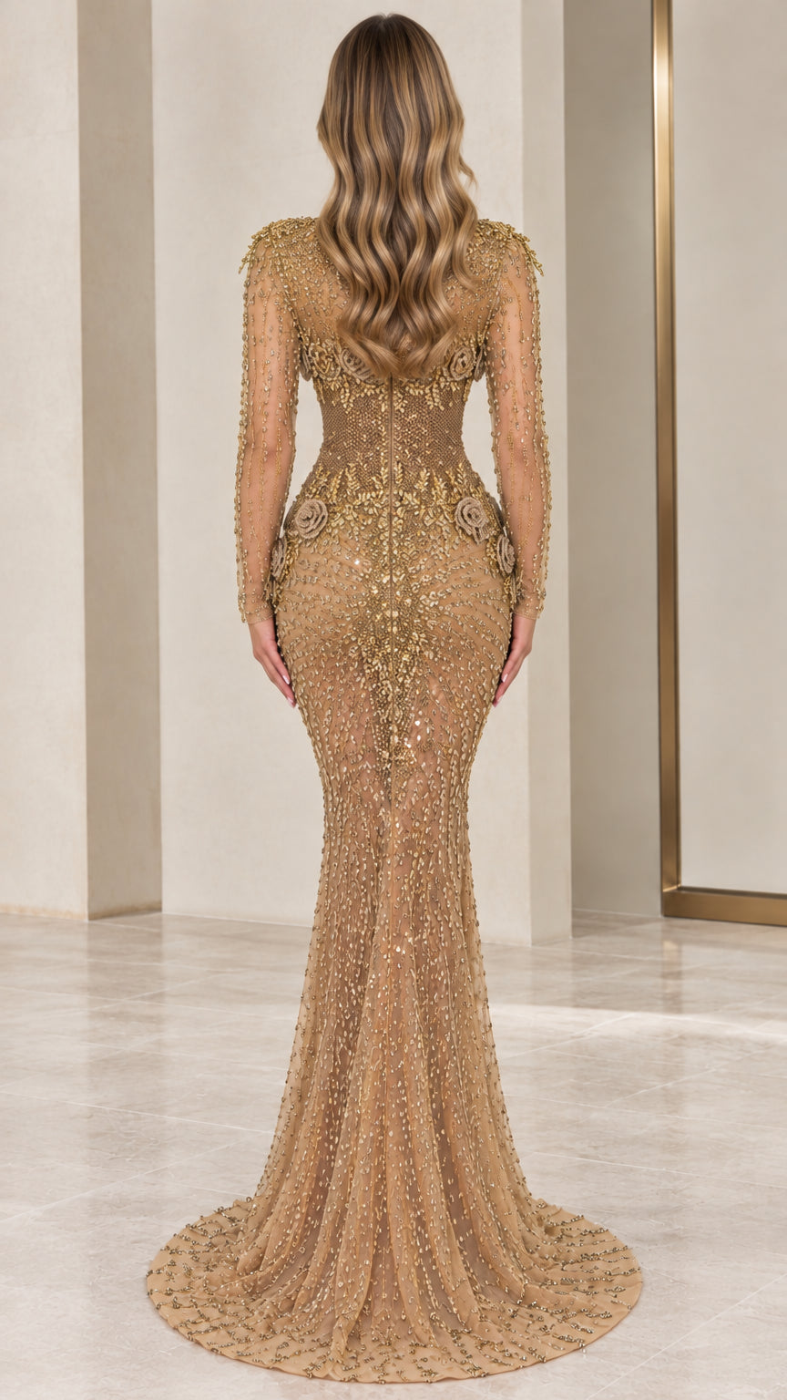 Back view of model showing fitted mermaid silhouette and subtle train on gold gown