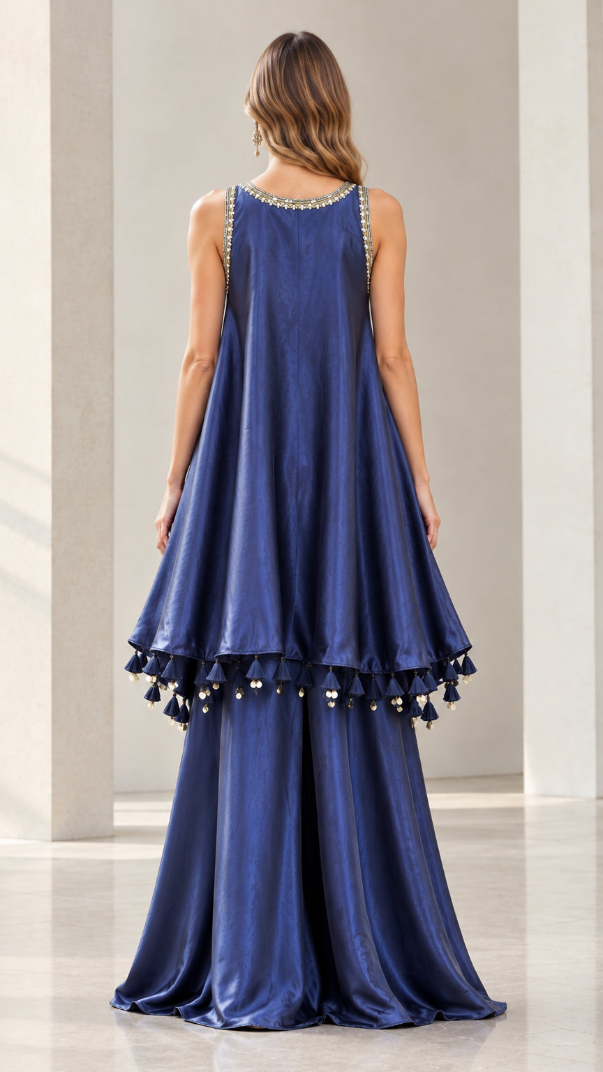 Back full-length view of Navy Blue sleeveless tiered tunic top and wide-leg trousers