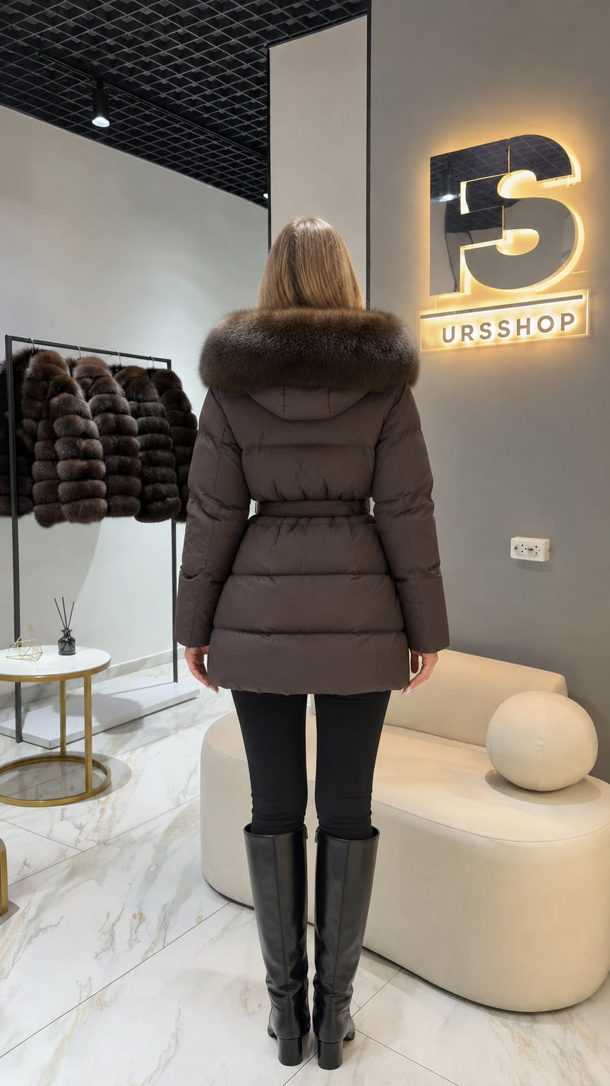 Back view of chocolate brown hooded puffer coat showing quilted panels and waist belt