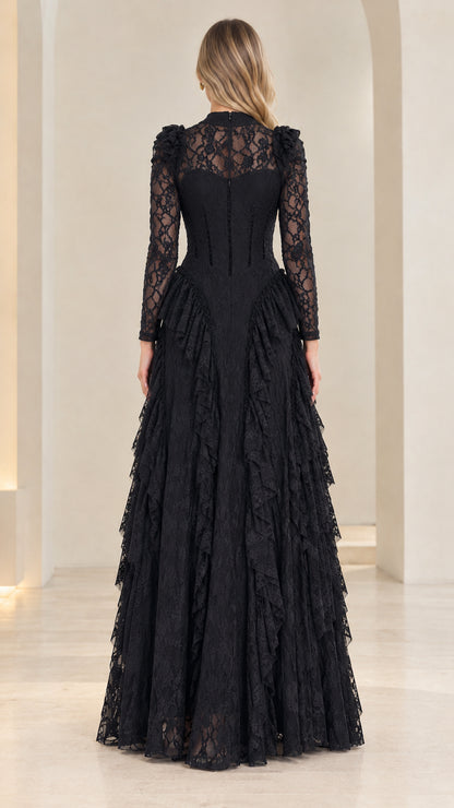 Back view of woman wearing sheer lace back black evening gown with back zipper