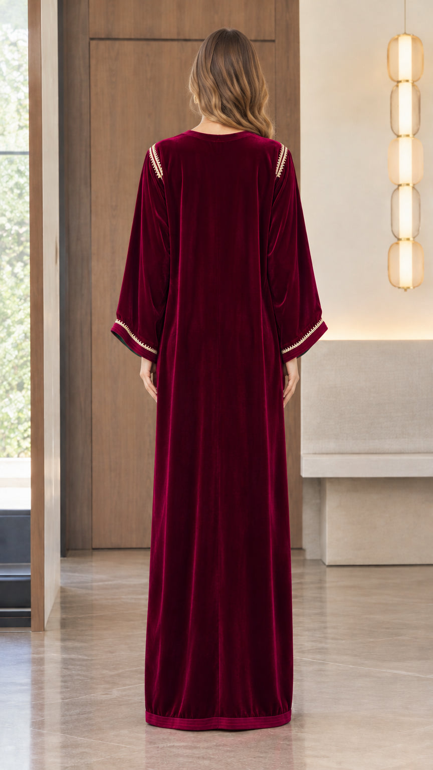 Back view of model showing the flowing drape of the Burgundy velvet kaftan