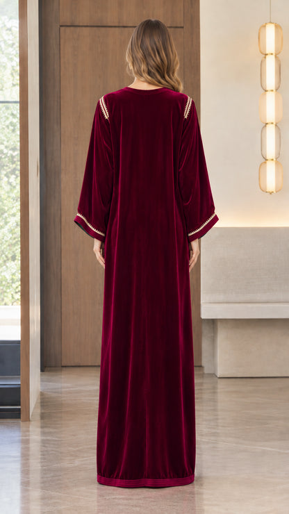 Back view of model showing the flowing drape of the Burgundy velvet kaftan