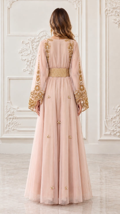 Back view of blush pink floor-length beaded kaftan dress
