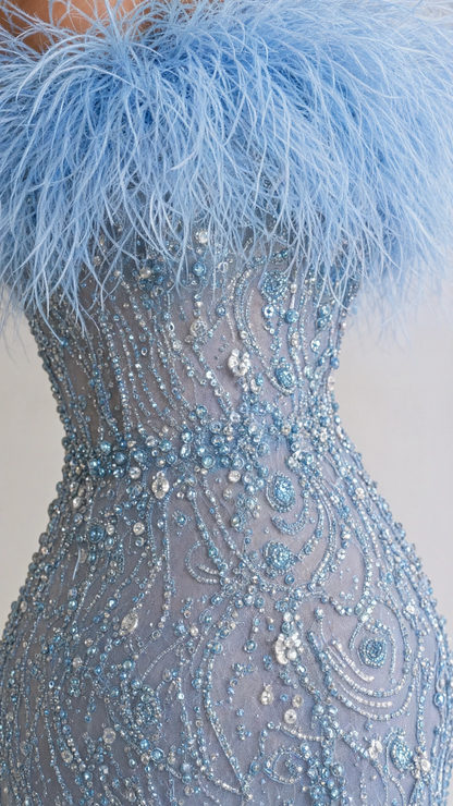 Close-up detail of plush sky blue feather neckline and intricate sequin beadwork on bodice