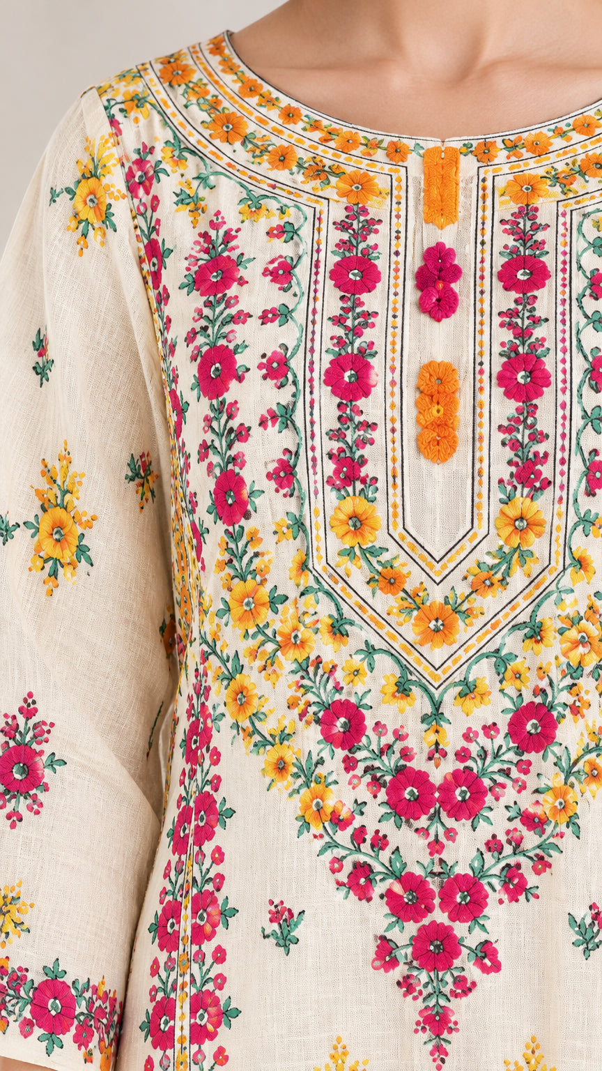 Close-up detail of colorful floral embroidery and neckline craftsmanship