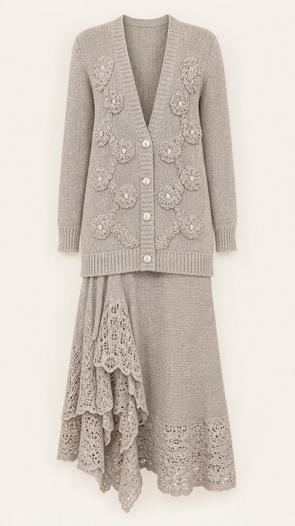Studio product flat lay of silver grey floral applique knit cardigan and lace hem skirt set