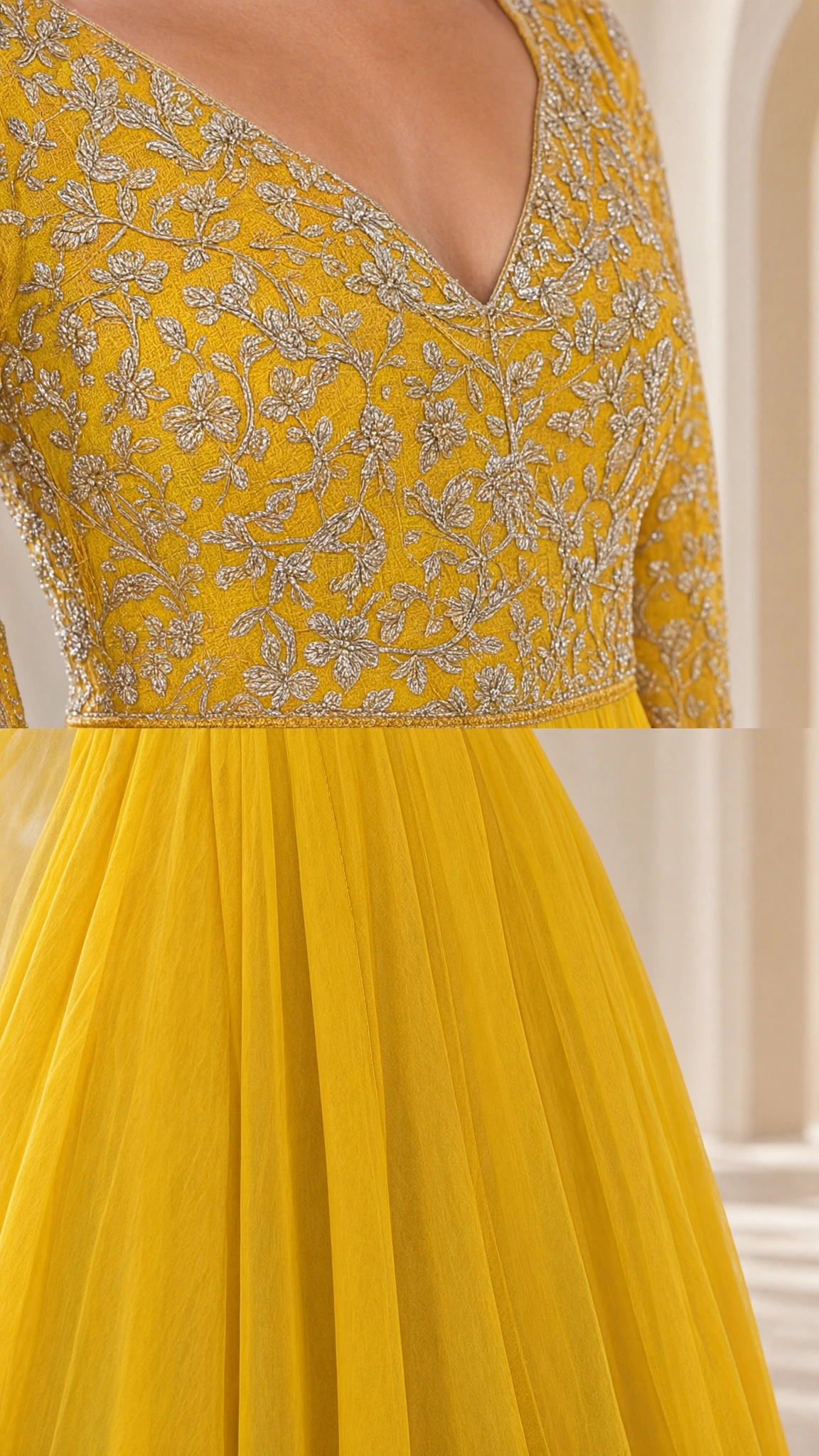 Close-up detail of yellow evening gown bodice showing intricate embroidery