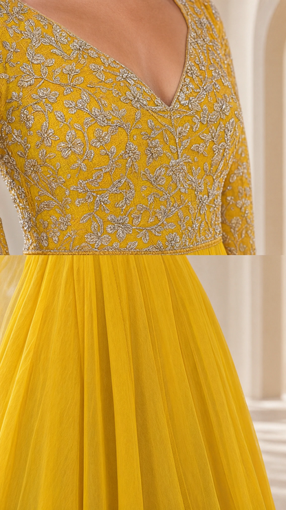 Close-up detail of yellow evening gown bodice showing intricate embroidery