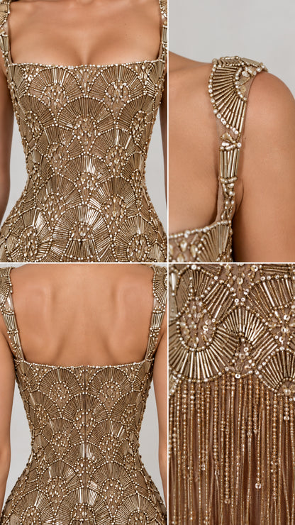 Close-up detail of geometric beadwork and fringe construction on bodice and straps