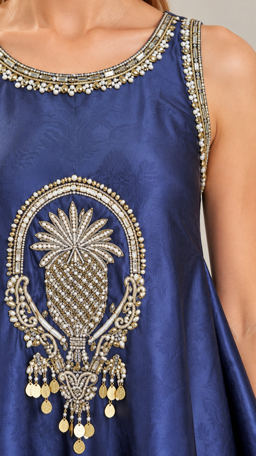 Close-up detail of ornate gold and bead embroidery on Navy Blue tunic neckline and chest