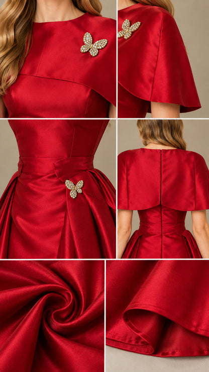 Close-up details of red satin evening gown showcasing rhinestone butterfly brooches and fabric sheen