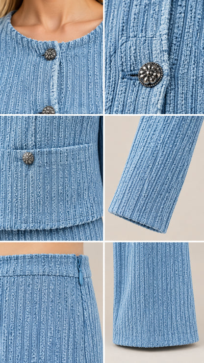 Close-up details of ribbed fabric texture ornate silver-tone buttons and sleeve hem