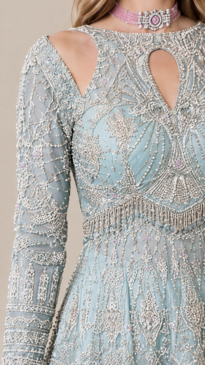 Close-up detail of beaded neckline, embroidery, and shoulder cutout