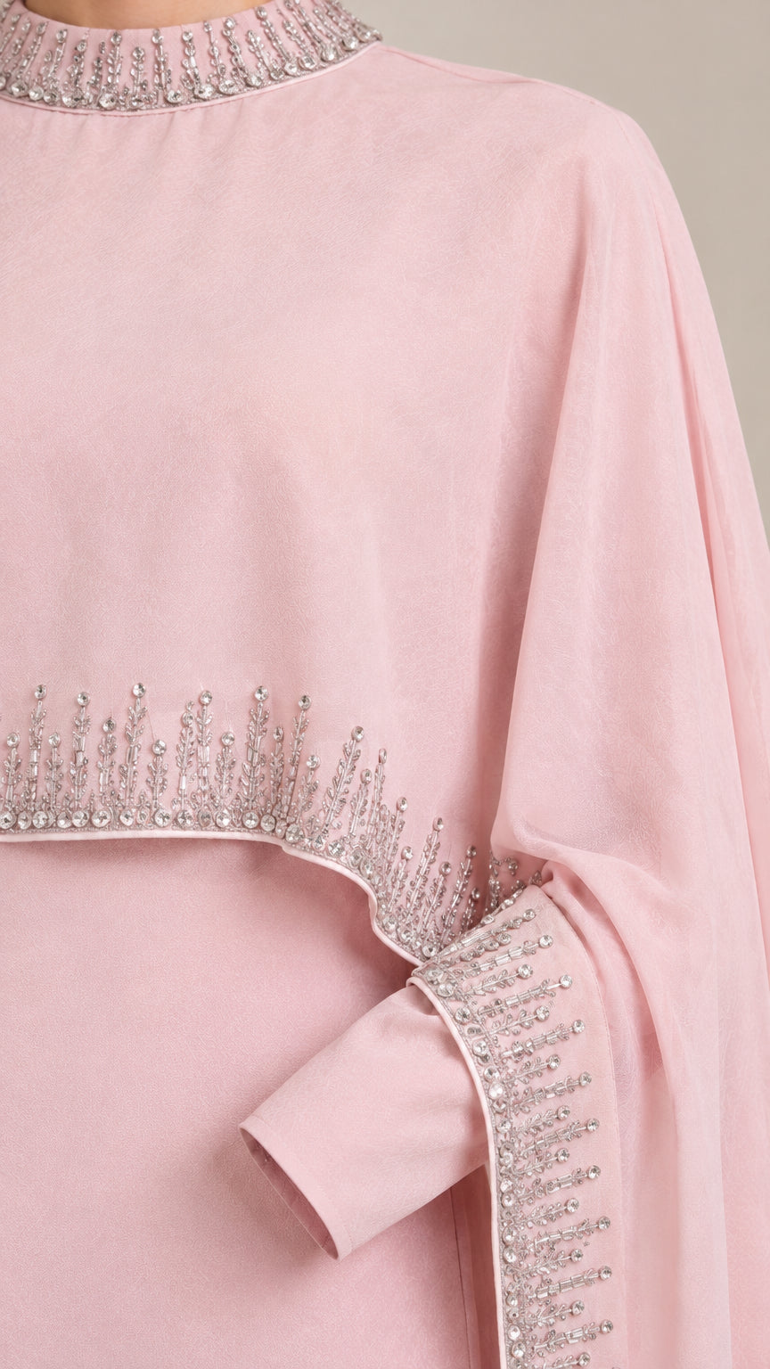 Close-up detail of Blush Pink evening gown collar and cape edge with intricate rhinestone beading