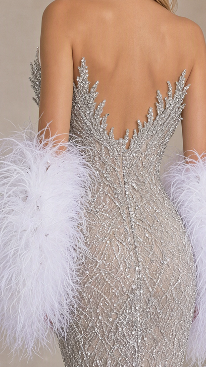 Close-up back detail of silver beaded bodice and plush feather sleeve cuff