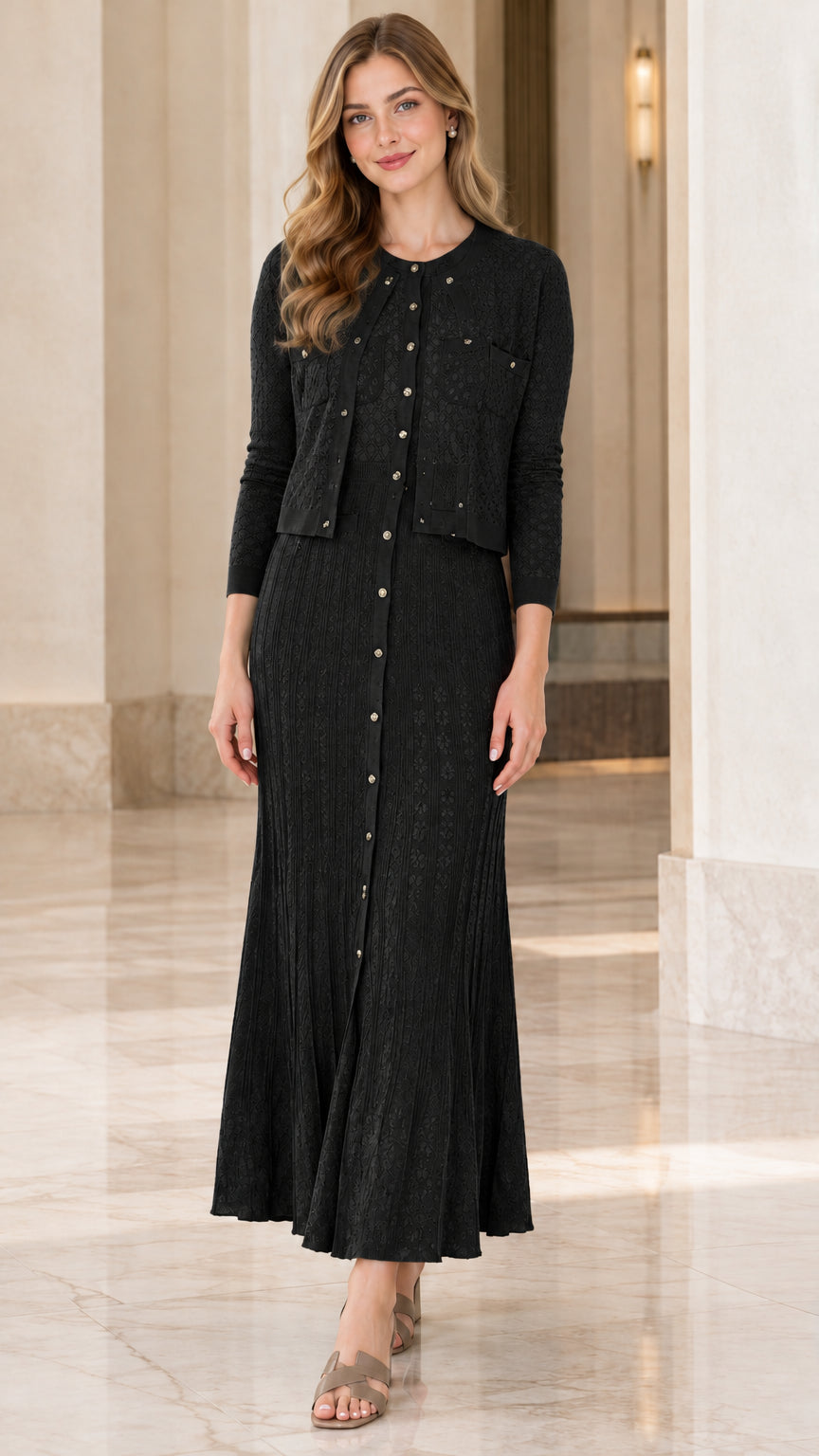 Model wearing black two-piece textured knit cardigan and maxi dress set