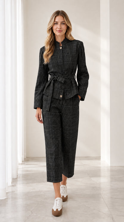 Full front view of model wearing charcoal black plaid belted two-piece pant suit set