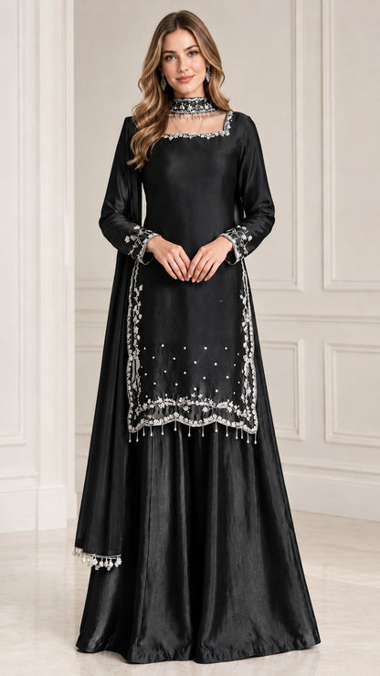 Front view of black embroidered satin sharara suit set