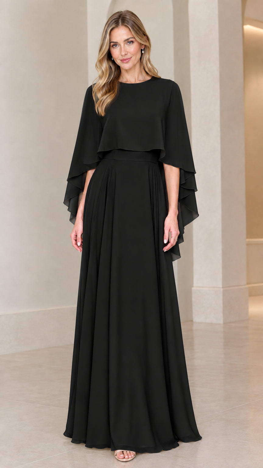 Front view of model wearing black chiffon capelet evening maxi dress