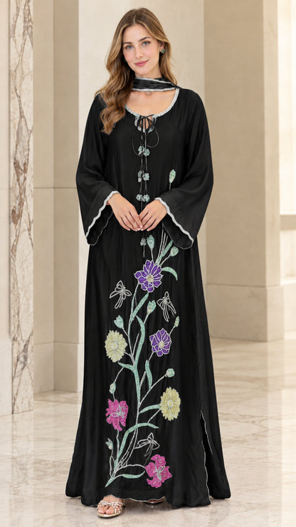 Front view of woman wearing Black floral embroidered beaded kaftan maxi dress