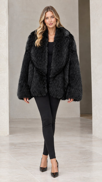Front view of woman wearing classic black faux fur coat with wide collar
