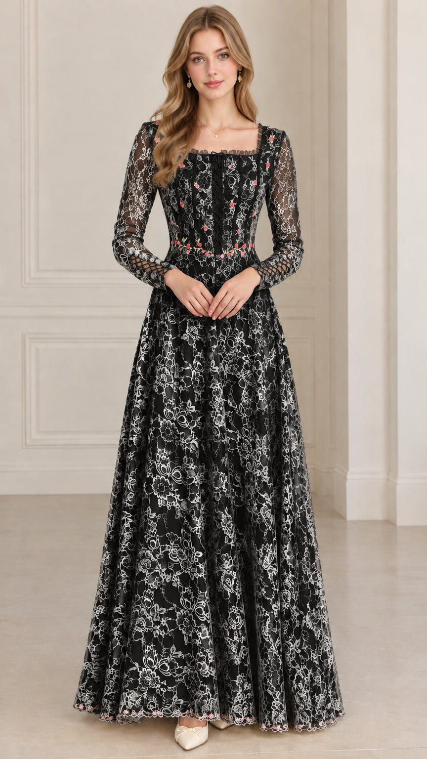 Front full-length view of model in black floral embroidered lace maxi dress