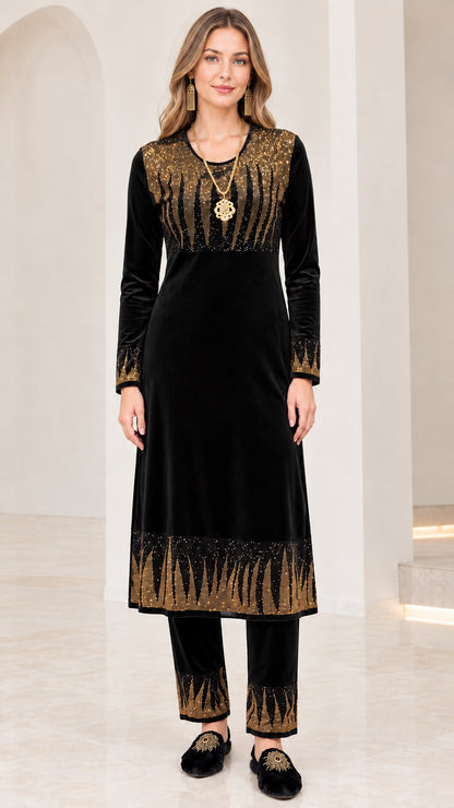 Full front view of women's black velvet tunic and trouser two-piece set with gold detailing