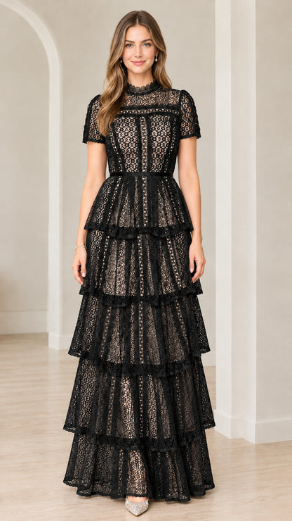 Front view of model wearing Black short sleeve tiered lace formal maxi gown