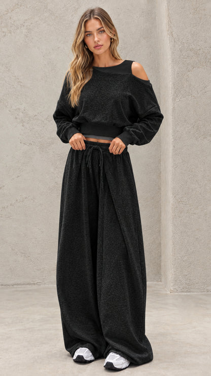 Full-length view of model wearing charcoal black cold shoulder wide leg lounge set