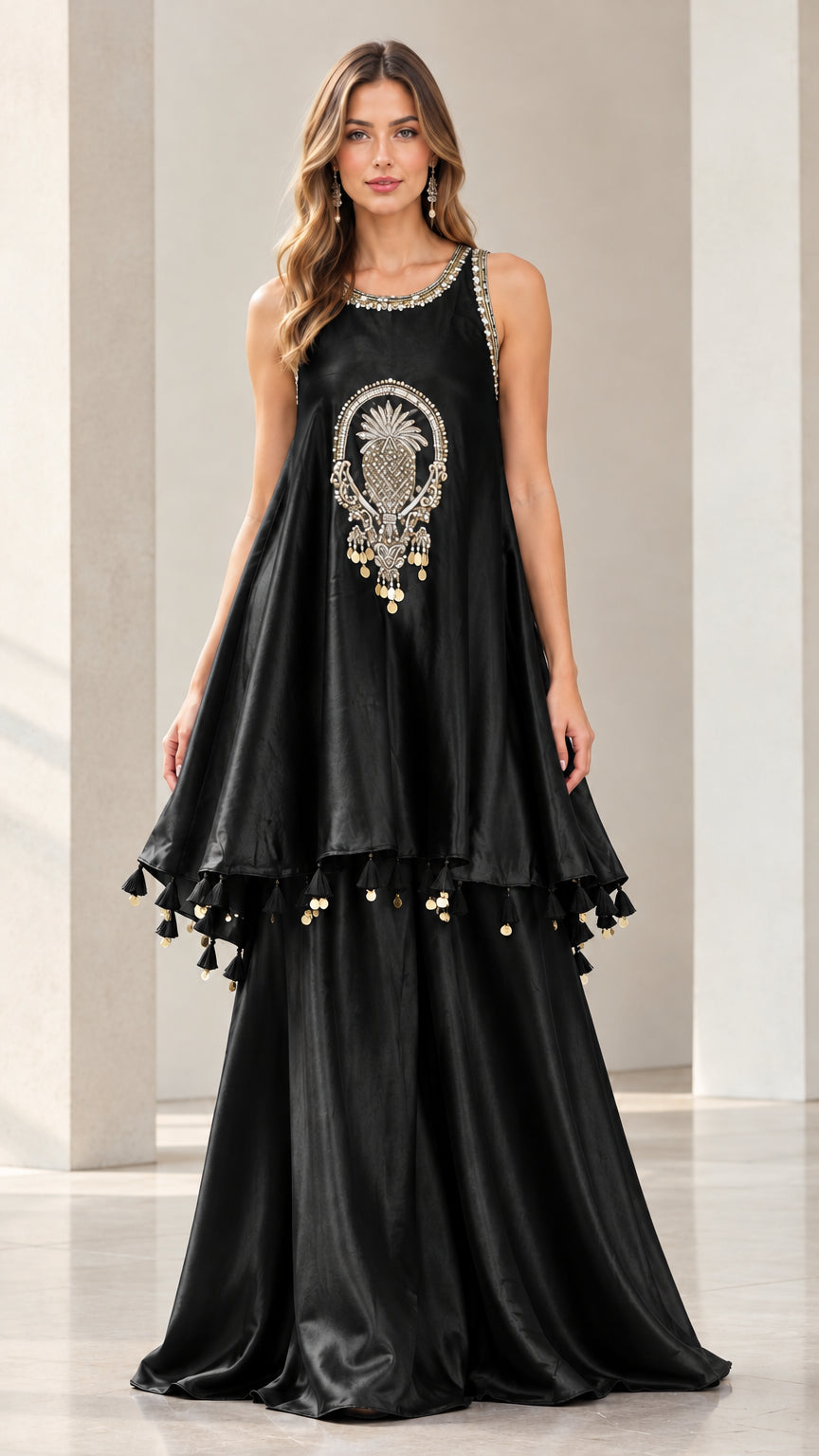 Front view of woman wearing Black embellished sleeveless peplum tunic and palazzo pants set