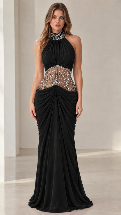 Front view of black halter neck beaded illusion evening gown