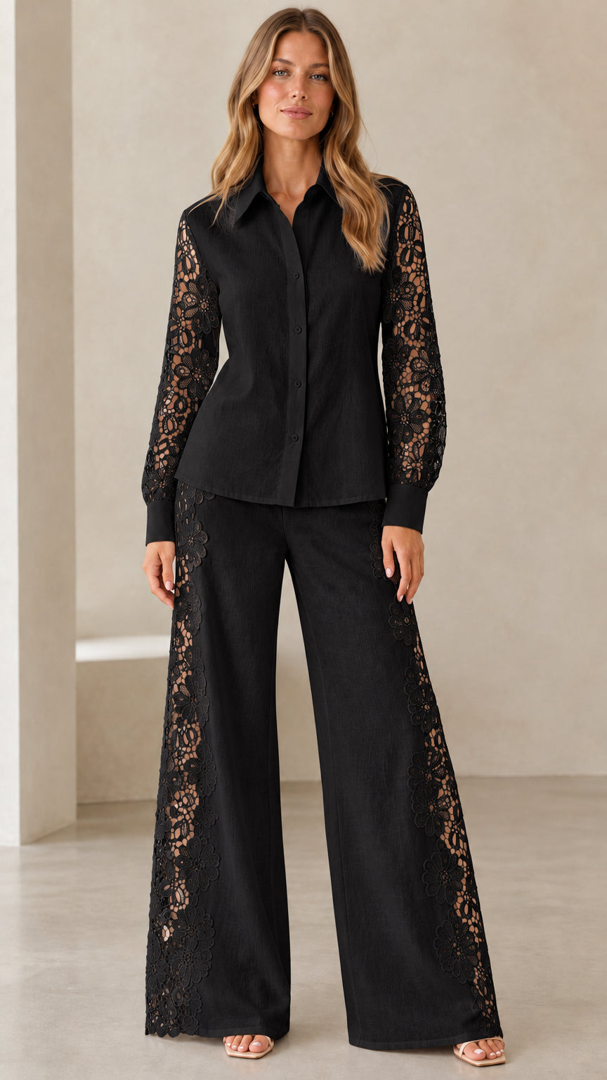 Front view of model wearing black lace button-down shirt and wide-leg pants set
