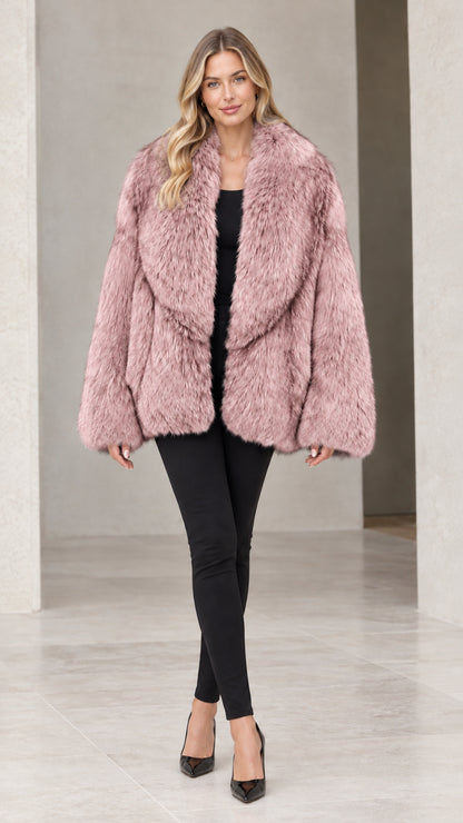 Front view of woman wearing dusty rose pink faux fur coat