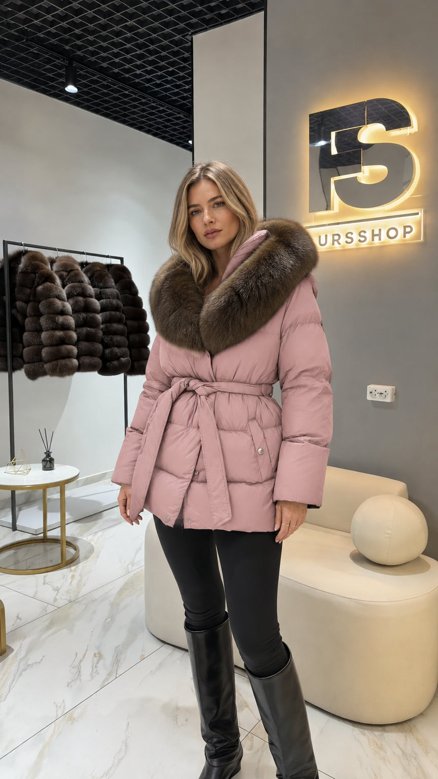Model wearing dusty pink belted puffer jacket with faux fur trim